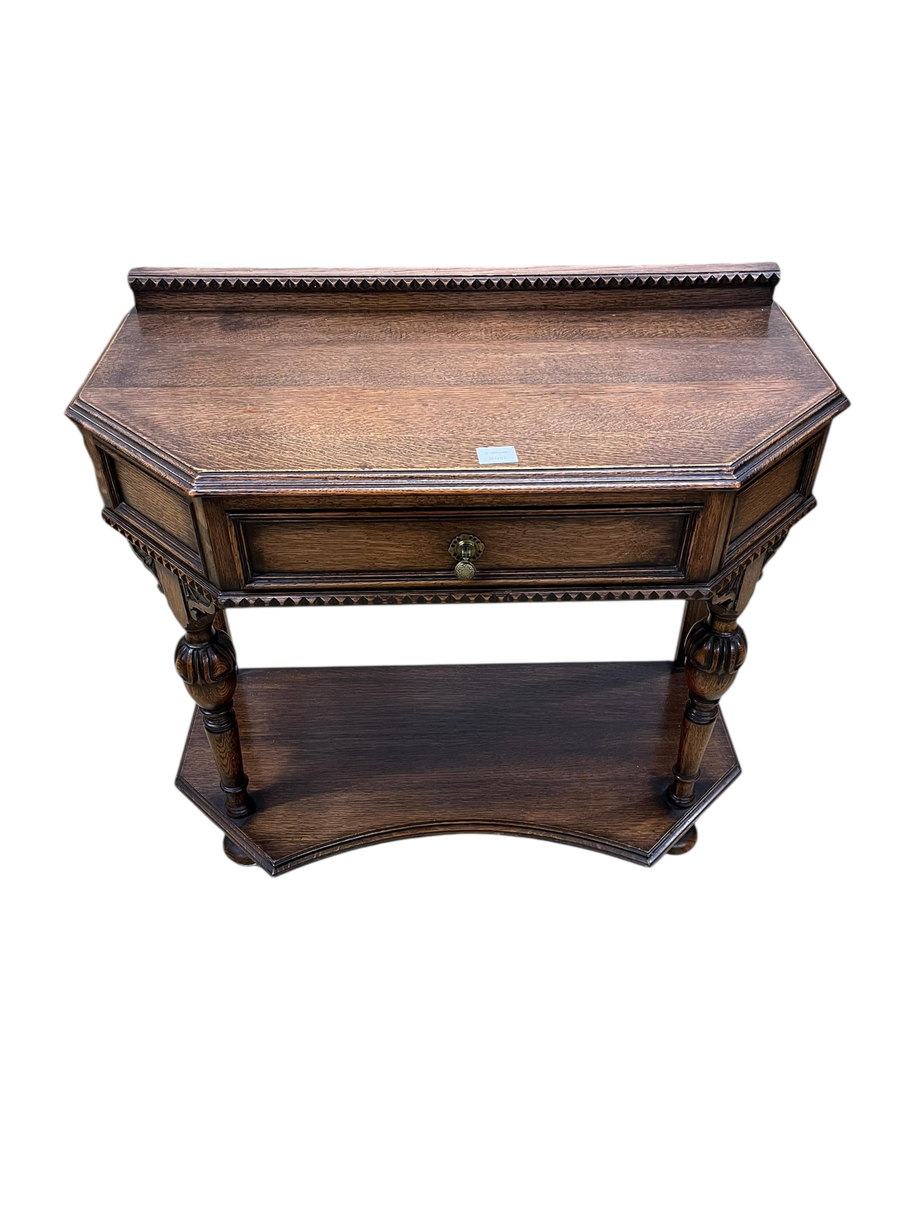 A Jacobean Revival oak two tier side table, width 90cm, depth 46cm, height 82cm